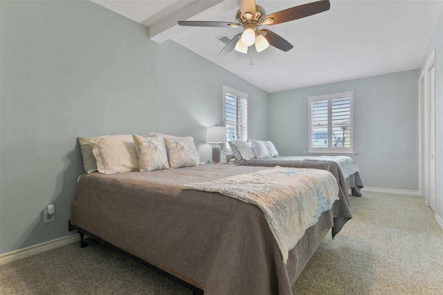 carpeted bedroom featuring ceiling fan and vaulted ceiling with beams