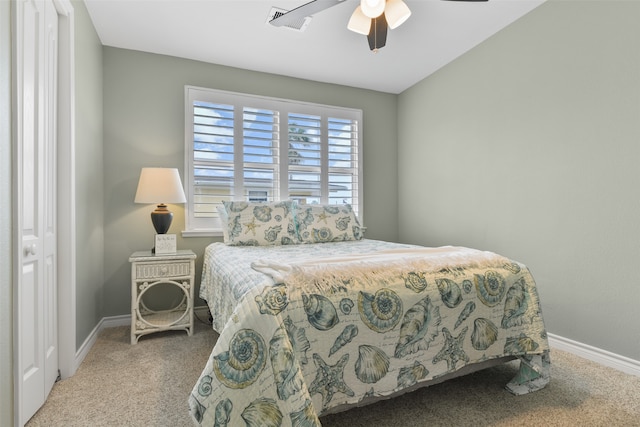 bedroom with a closet, ceiling fan, and carpet floors