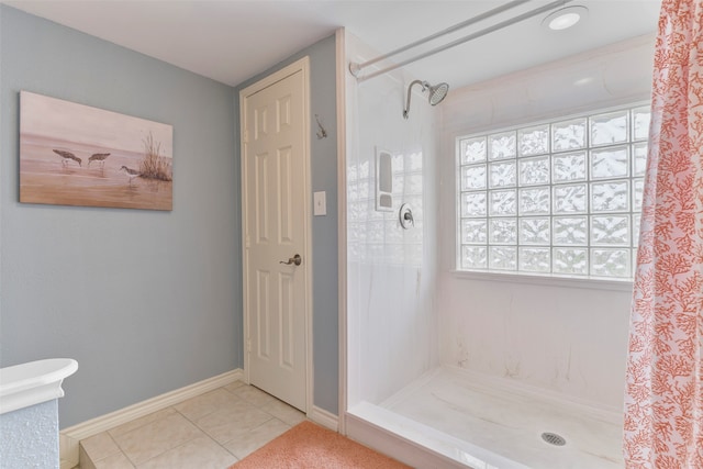 bathroom with walk in shower and tile patterned floors