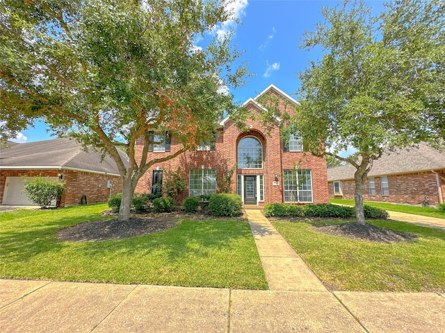 view of front of house with a front lawn and a garage