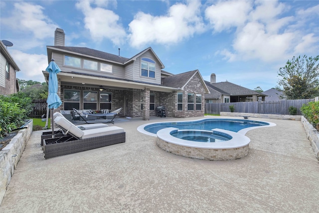 view of pool with a grill, an outdoor hangout area, an in ground hot tub, and a patio area