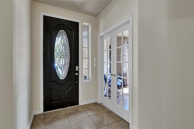 tiled entryway featuring a wealth of natural light and french doors