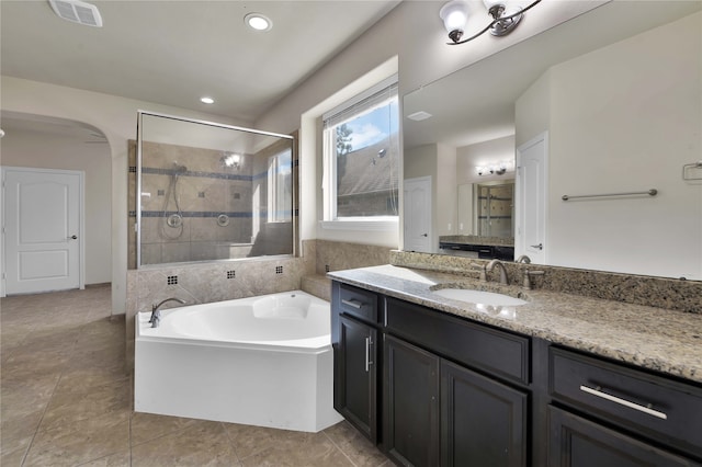 bathroom with vanity and plus walk in shower