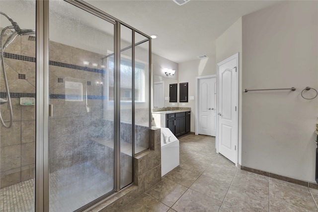 bathroom with walk in shower and vanity