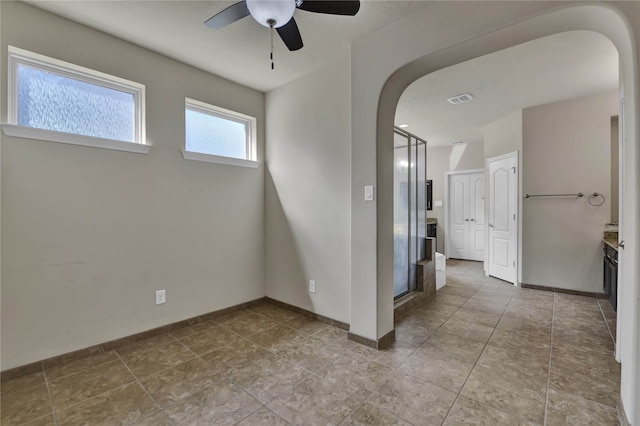 empty room featuring ceiling fan