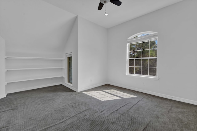 interior space with carpet floors, vaulted ceiling, and ceiling fan