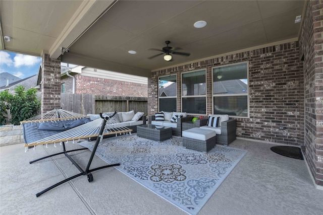 view of patio / terrace featuring an outdoor living space and ceiling fan