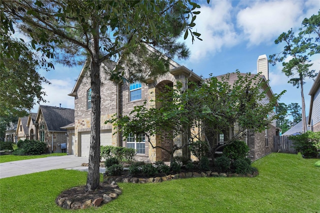 view of front of home featuring a garage and a front yard