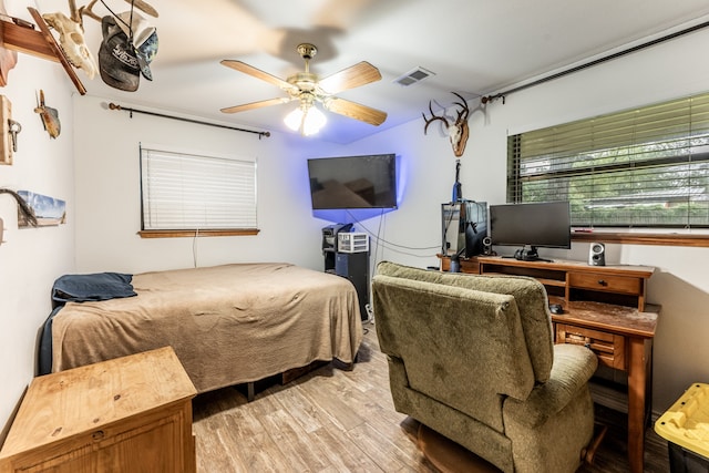 bedroom featuring light wood-type flooring and ceiling fan