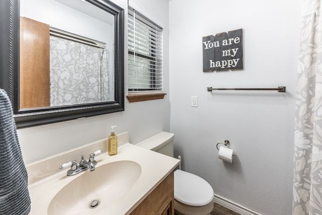 bathroom with vanity and toilet