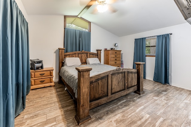 bedroom with lofted ceiling, ceiling fan, and light hardwood / wood-style floors