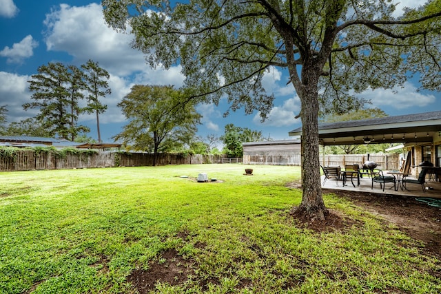 view of yard with a patio area and an outdoor fire pit