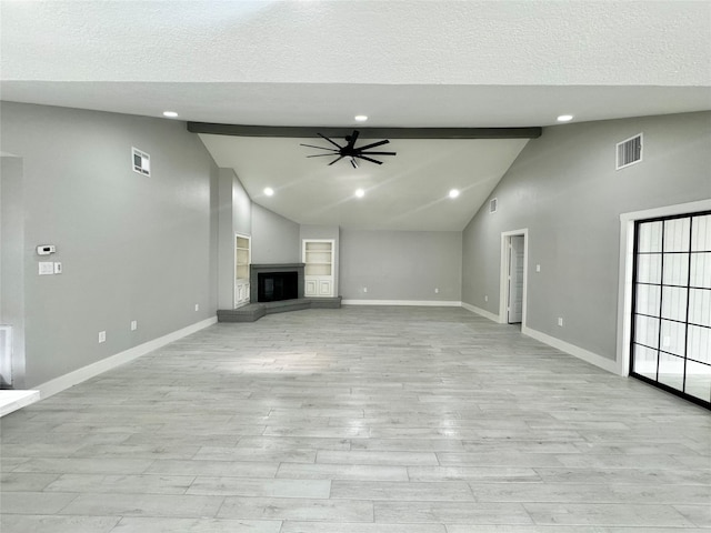 unfurnished living room featuring high vaulted ceiling, beamed ceiling, light wood-type flooring, a textured ceiling, and ceiling fan