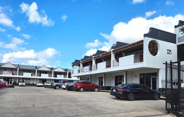 9788 Clarewood Dr Unit 201, Houston, TX 77036 - view of building exterior featuring uncovered parking and a residential view