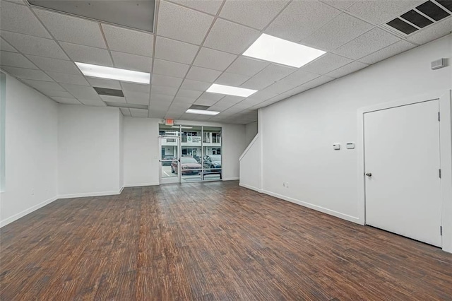 9788 Clarewood Dr Unit 201, Houston, TX 77036 - empty room with wood finished floors, baseboards, and a paneled ceiling