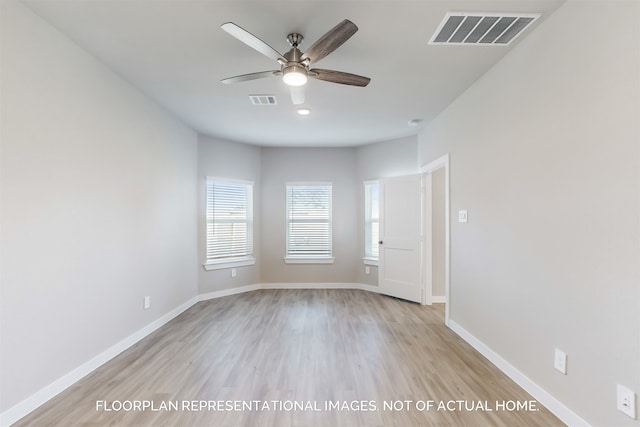 spare room with light hardwood / wood-style floors and ceiling fan