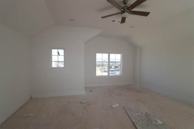 additional living space featuring lofted ceiling, a wealth of natural light, and ceiling fan