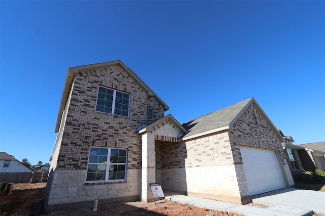 view of front of property with a garage