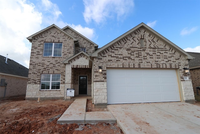 view of front of house with concrete driveway, brick siding, and an attached garage