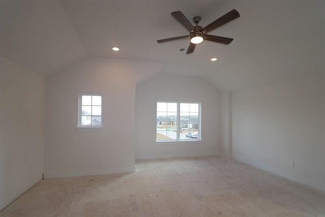 bonus room with plenty of natural light, lofted ceiling, and ceiling fan