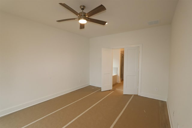 unfurnished bedroom featuring baseboards, visible vents, and a ceiling fan