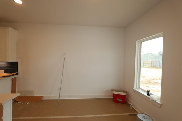 interior space featuring plenty of natural light and baseboards