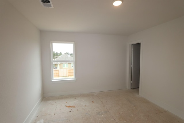 empty room featuring visible vents and baseboards