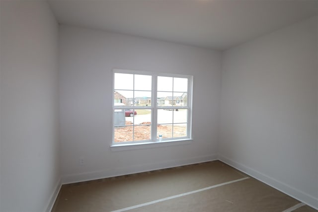 empty room featuring baseboards