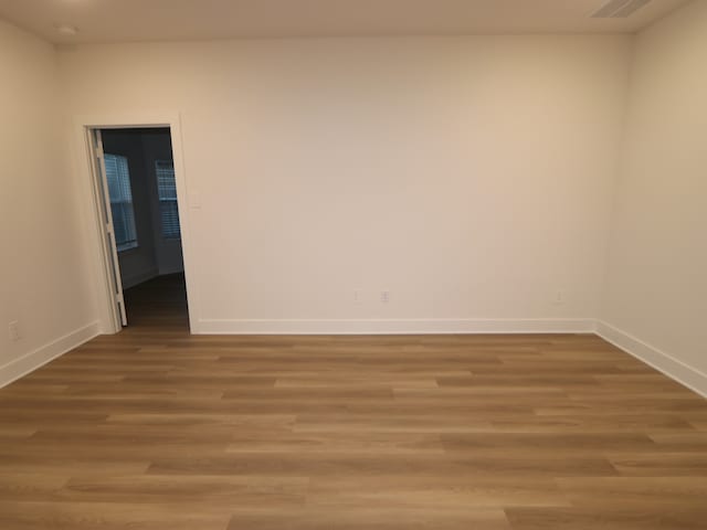 234 Augustine Way, Magnolia, TX 77354 - empty room with light wood-type flooring