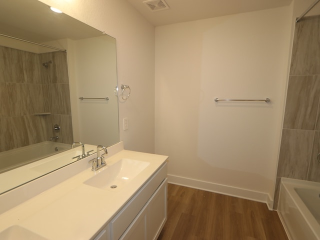 234 Augustine Way, Magnolia, TX 77354 - bathroom featuring vanity, shower / bath combination, and wood finished floors