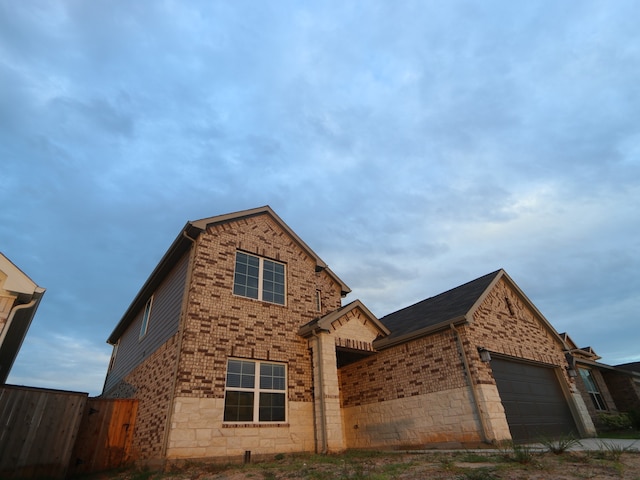 234 Augustine Way, Magnolia, TX 77354 - traditional-style home featuring a garage, brick siding, and stone siding