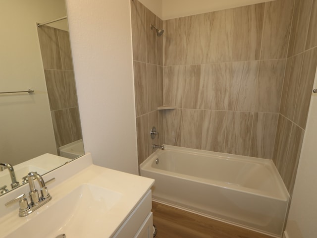 234 Augustine Way, Magnolia, TX 77354 - bathroom with vanity, washtub / shower combination, and wood finished floors