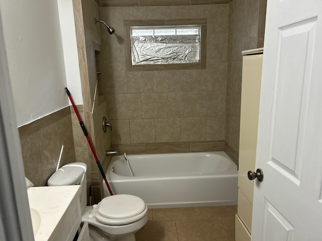 full bathroom with tile patterned flooring, vanity, toilet, and tiled shower / bath