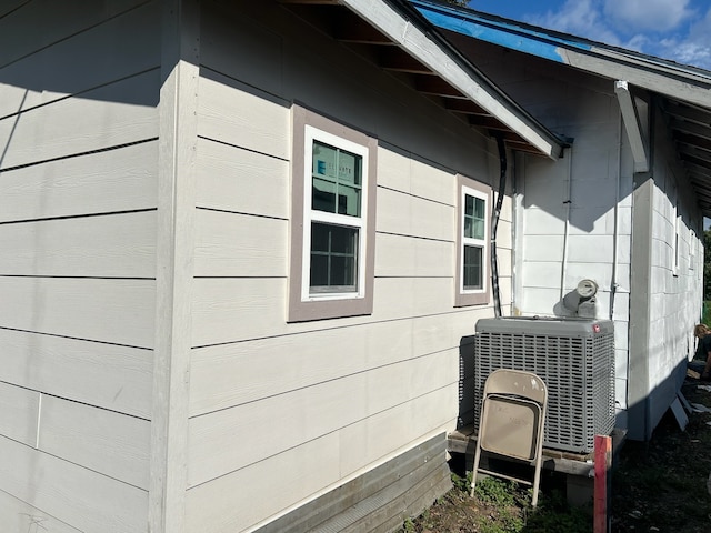 view of side of property featuring central AC unit