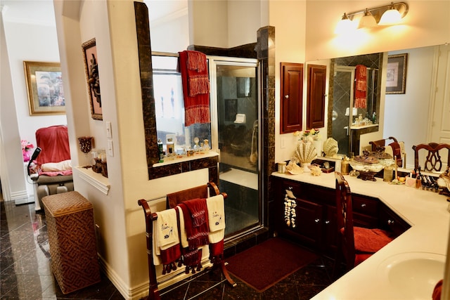 bathroom with ornamental molding, vanity, and a shower with shower door