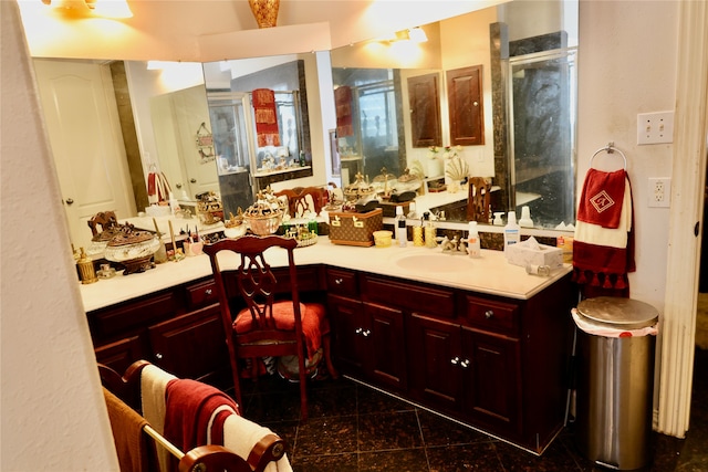 bathroom featuring vanity and a shower with shower door