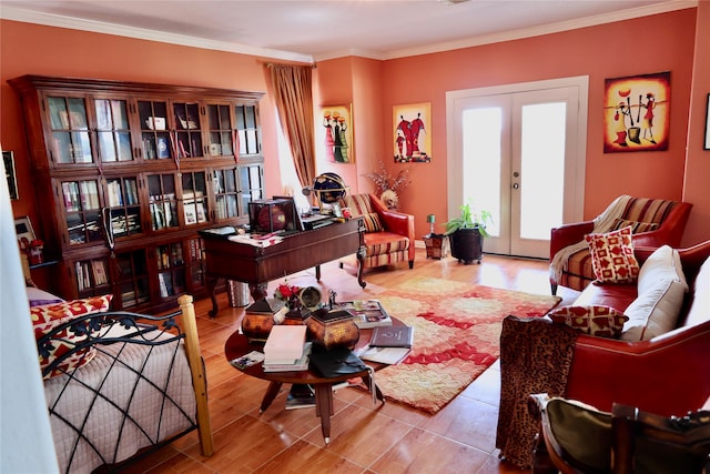 living room with french doors, light hardwood / wood-style flooring, and ornamental molding