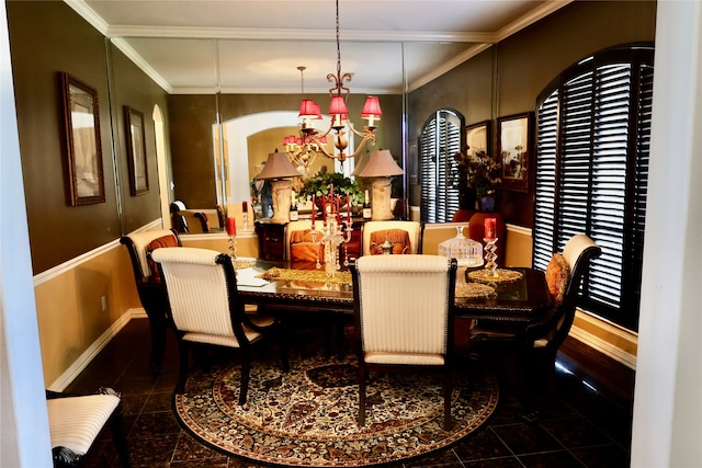 dining room featuring ornamental molding and a chandelier