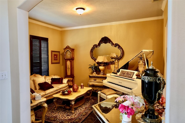 living area with a textured ceiling and crown molding