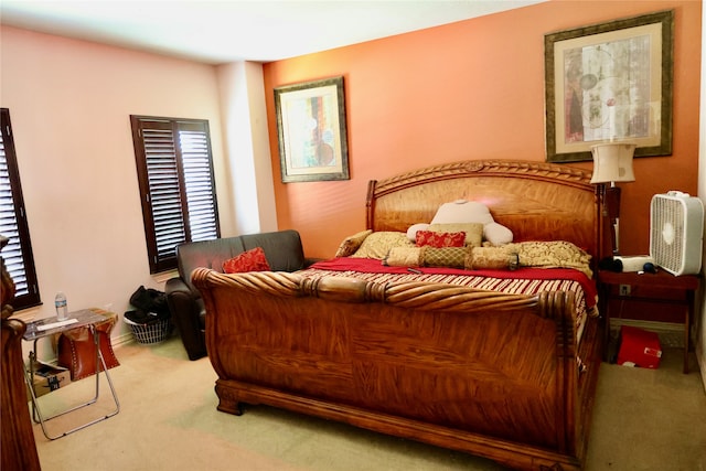 carpeted bedroom with multiple windows