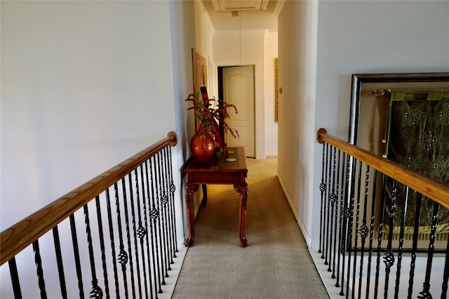 hall featuring light colored carpet