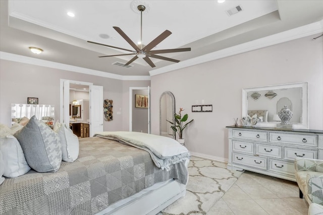 bedroom with connected bathroom, ornamental molding, a raised ceiling, and ceiling fan