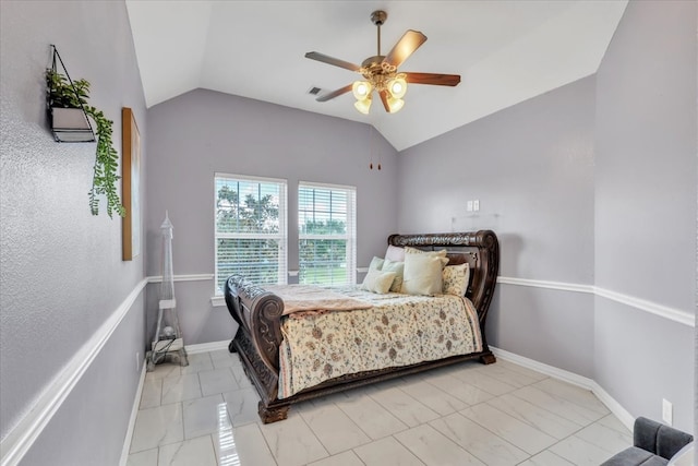 bedroom featuring ceiling fan and lofted ceiling