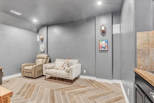 living area with light parquet floors