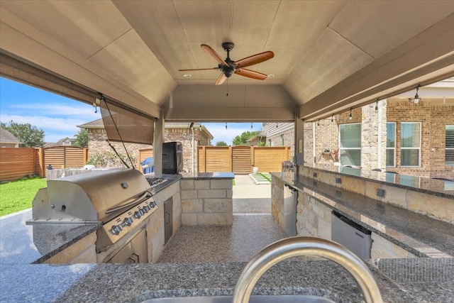 view of patio featuring area for grilling, sink, and ceiling fan