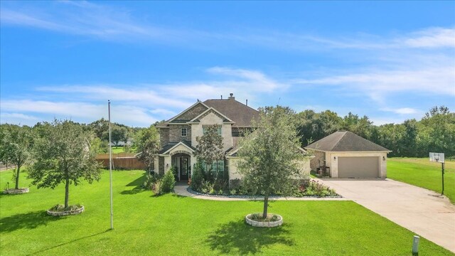 view of front of home featuring a garage and a front lawn