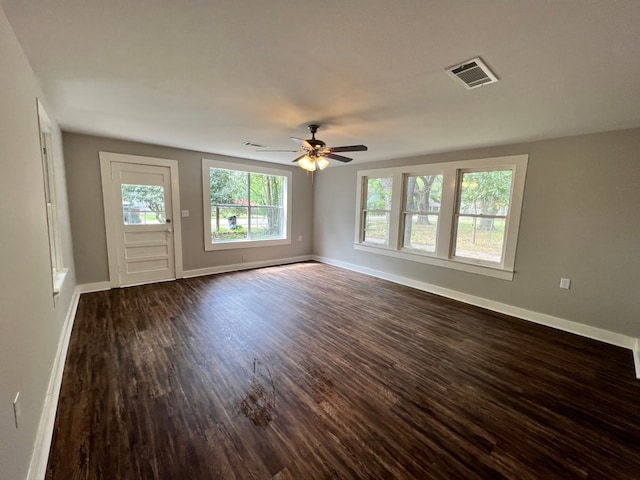 unfurnished room featuring ceiling fan and dark hardwood / wood-style flooring