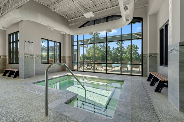 view of pool with an indoor in ground hot tub