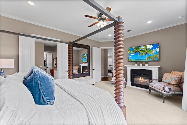 bedroom with crown molding, ceiling fan, and light colored carpet