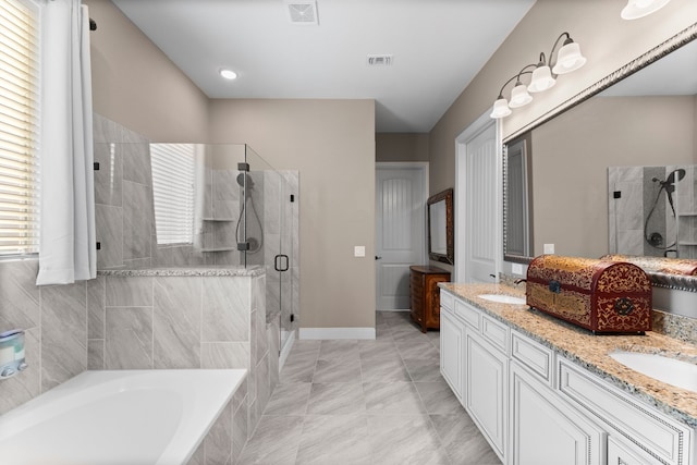 bathroom featuring plus walk in shower, tile patterned flooring, and vanity